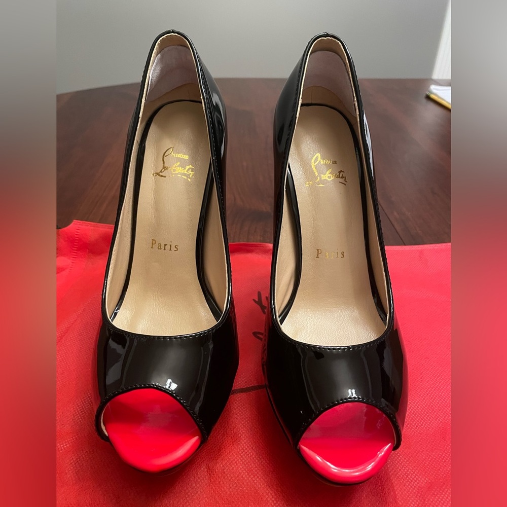 EUC women’s black platform patent leather Christian Louboutin peep toe heels.